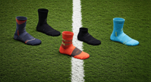 Colorful soccer socks on grass